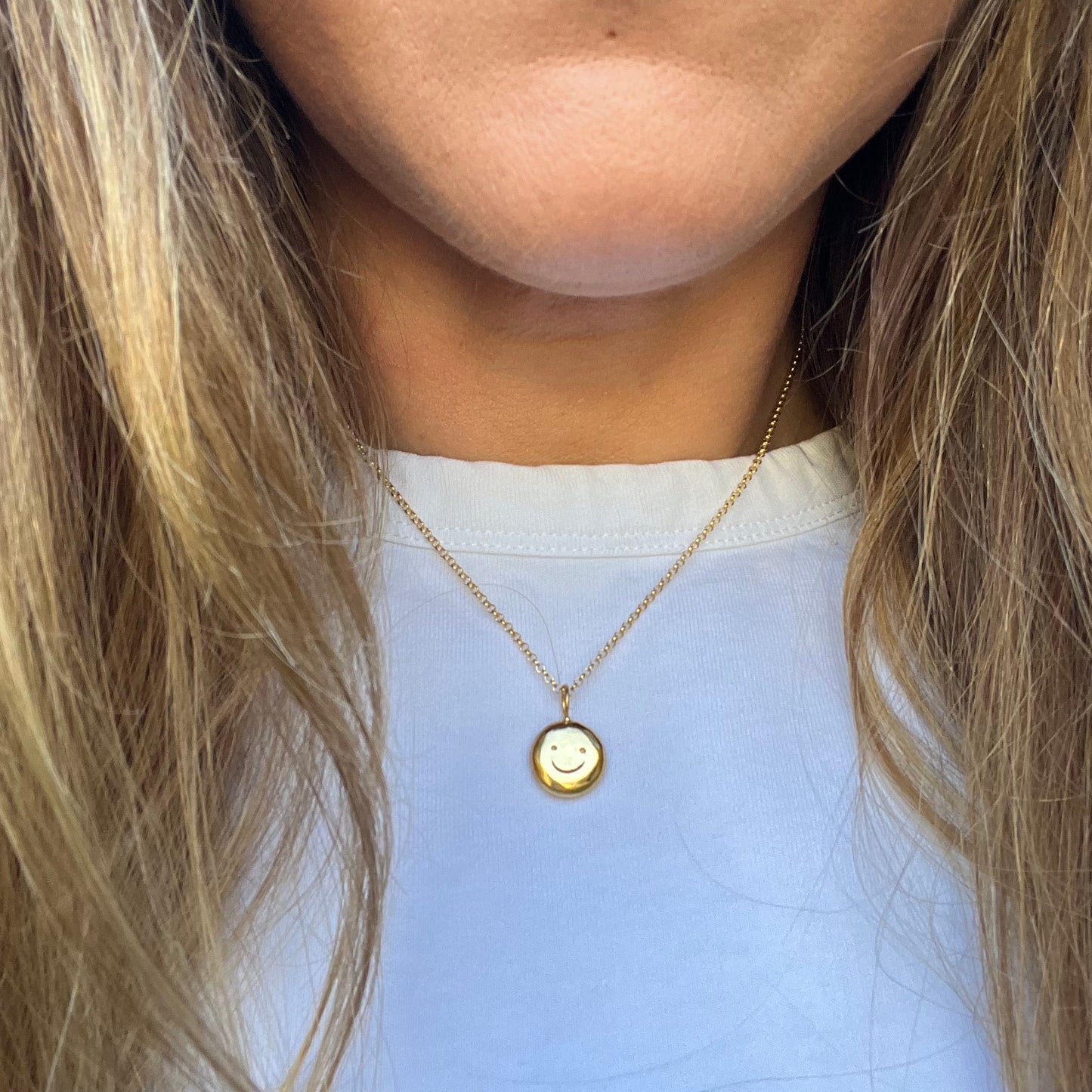 Gold plated smiley pendant