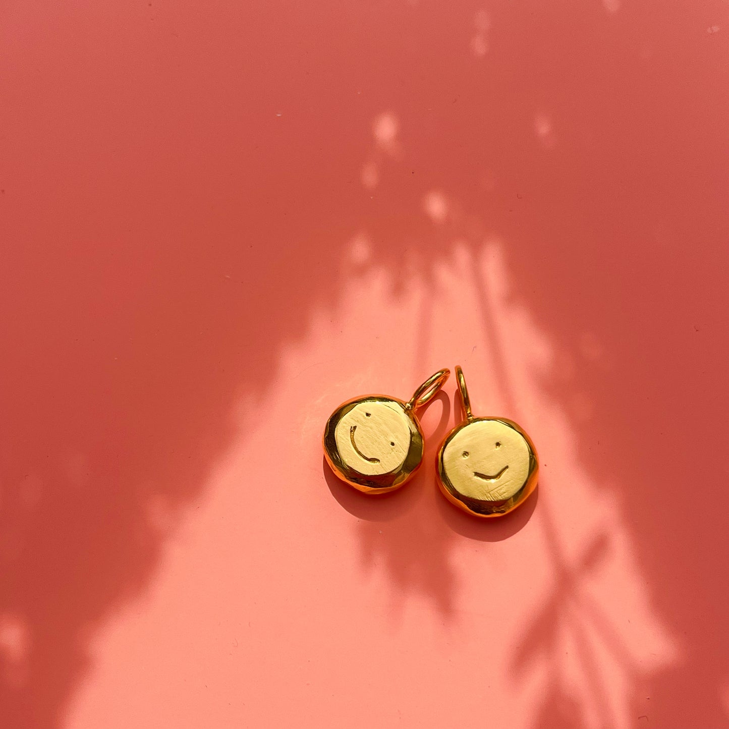 Gold plated smiley pendant